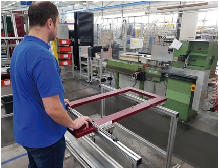 Inspection of an aluminum frame with a TESA TWIN-CAL IP67 horizontal scale unit.
